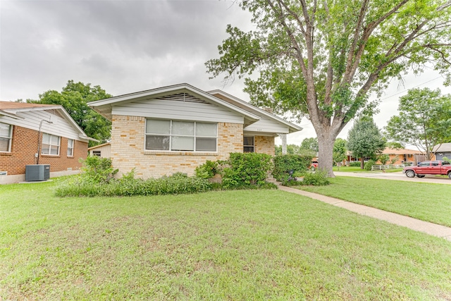 307 E Rio Grande St, Garland, TX 75041 - ranch-style home featuring brick siding, a front lawn, and cooling unit