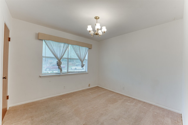 307 E Rio Grande St, Garland, TX 75041 - unfurnished room with a chandelier, light carpet, and baseboards