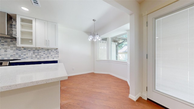 2350 Ravenwood Dr, Grand Prairie, TX 75050 - unfurnished dining area featuring a chandelier, light wood-style floors, baseboards, and recessed lighting