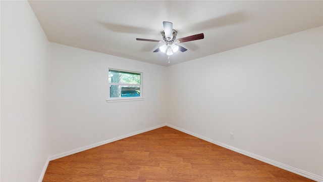 2350 Ravenwood Dr, Grand Prairie, TX 75050 - spare room with light wood finished floors, baseboards, and a ceiling fan