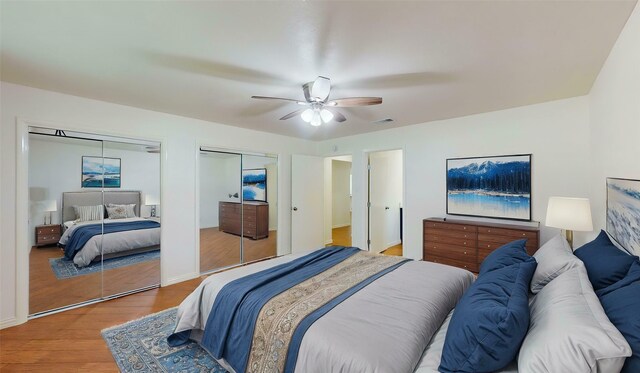 2350 Ravenwood Dr, Grand Prairie, TX 75050 - bedroom with multiple closets, wood finished floors, and ceiling fan