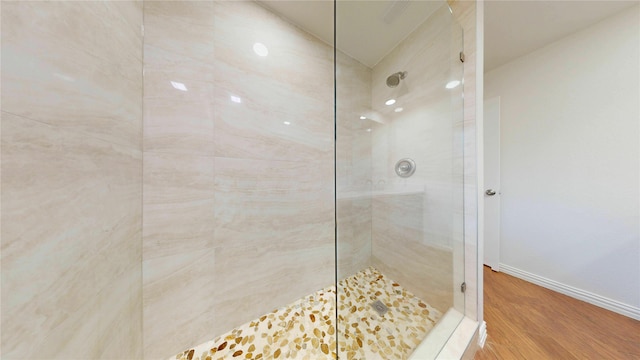 2350 Ravenwood Dr, Grand Prairie, TX 75050 - bathroom featuring walk in shower, wood finished floors, and baseboards