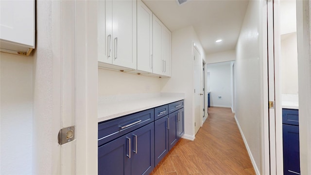 2350 Ravenwood Dr, Grand Prairie, TX 75050 - hallway featuring light wood-style flooring, recessed lighting, and baseboards