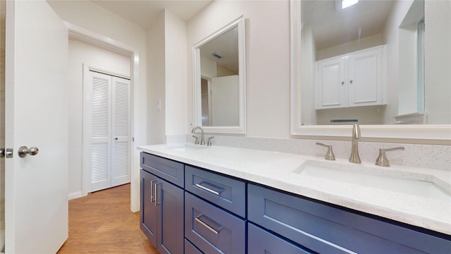 2350 Ravenwood Dr, Grand Prairie, TX 75050 - full bath featuring double vanity, wood finished floors, and a closet