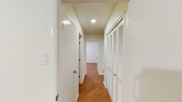 2350 Ravenwood Dr, Grand Prairie, TX 75050 - hall featuring light wood-style flooring, recessed lighting, and baseboards