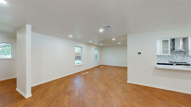 2350 Ravenwood Dr, Grand Prairie, TX 75050 - spare room with light wood finished floors, baseboards, and recessed lighting