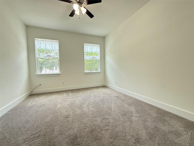 201 E 10th St, Kaufman, TX 75142 - unfurnished room featuring carpet, a ceiling fan, and baseboards