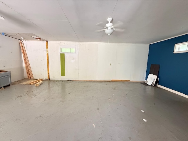 201 E 10th St, Kaufman, TX 75142 - garage featuring a ceiling fan