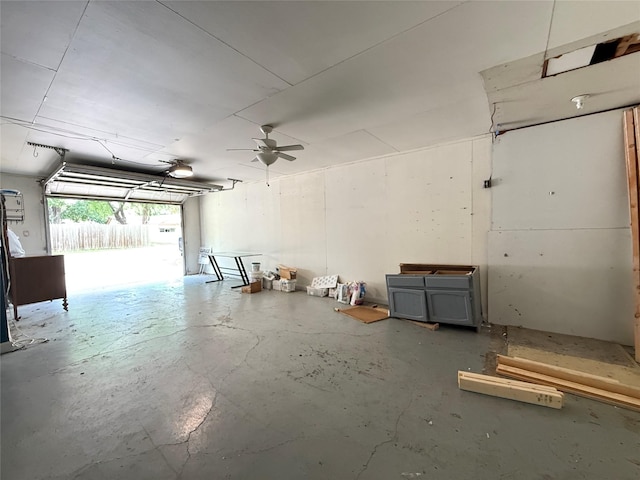 201 E 10th St, Kaufman, TX 75142 - garage with ceiling fan and a garage door opener