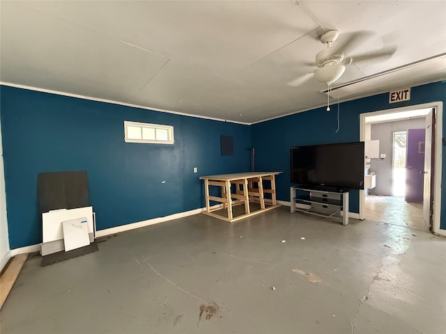 201 E 10th St, Kaufman, TX 75142 - below grade area featuring ceiling fan and baseboards