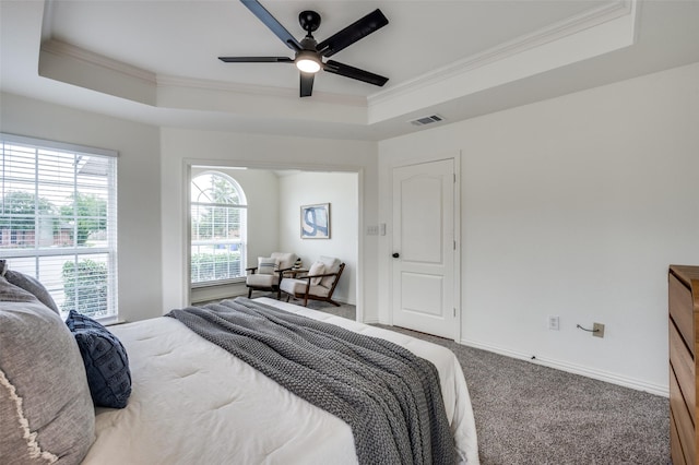 212 Cory Ct, Krum, TX 76249 - carpeted bedroom with a raised ceiling, ornamental molding, baseboards, and a ceiling fan