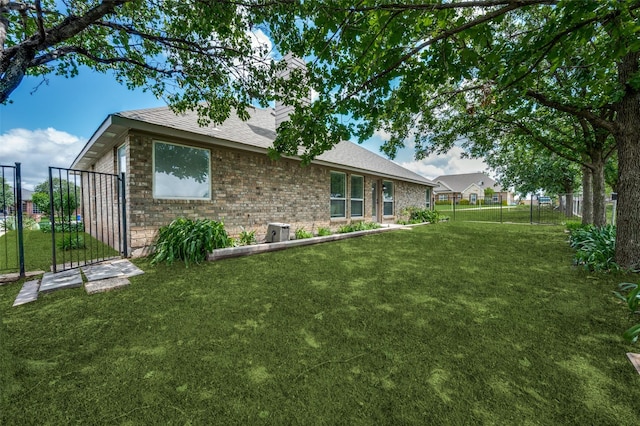 212 Cory Ct, Krum, TX 76249 - back of property with brick siding and roof with shingles
