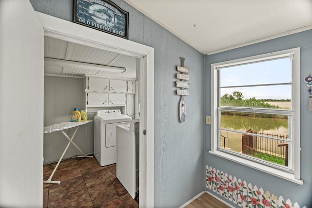 5407 Water View Dr, Granbury, TX 76048 - laundry room featuring cabinet space and washing machine and clothes dryer