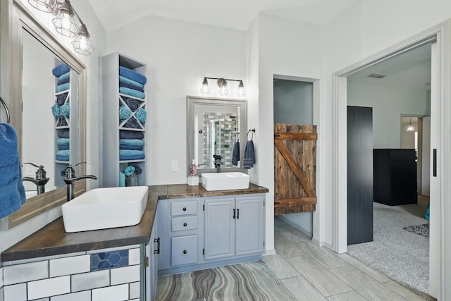4408 Sunny Oak Ln, Corinth, TX 76208 - bathroom featuring double vanity and lofted ceiling