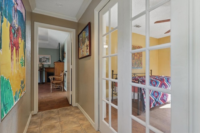 2739 Timberleaf Dr, Carrollton, TX 75006 - hallway featuring tile patterned flooring, ornamental molding, baseboards, and french doors