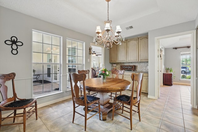 2739 Timberleaf Dr, Carrollton, TX 75006 - dining space featuring a chandelier, light tile patterned floors, and baseboards