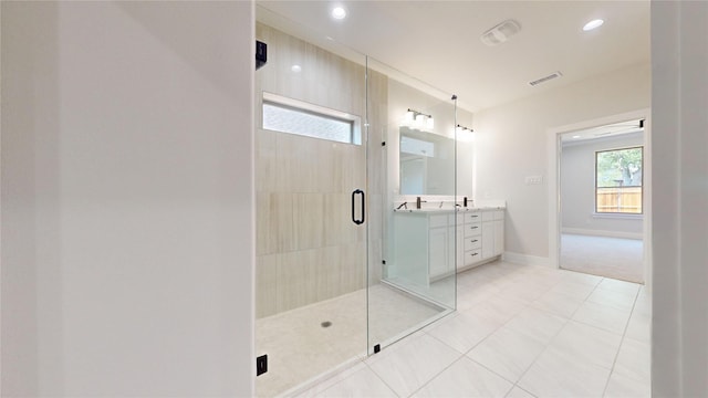 6857 Rutland Dr, Arlington, TX 76002 - full bathroom featuring double vanity, tiled shower, baseboards, recessed lighting, and tile patterned flooring