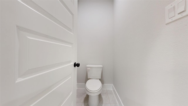 6857 Rutland Dr, Arlington, TX 76002 - bathroom featuring tile patterned floors, toilet, and baseboards