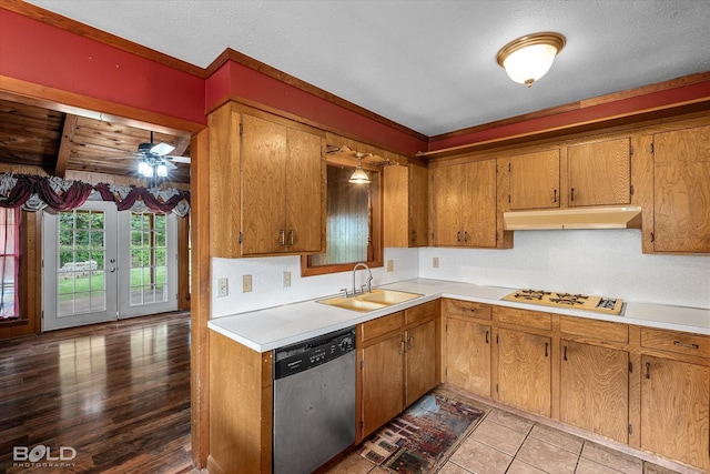 2020 Venus Dr, Bossier City, LA 71112 - kitchen featuring dishwasher, under cabinet range hood, a sink, light countertops, and white gas cooktop
