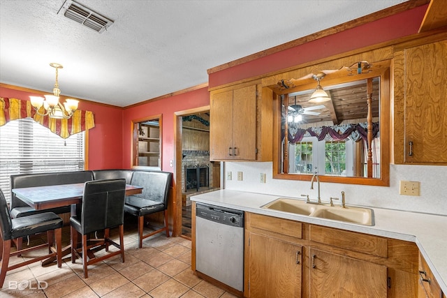 2020 Venus Dr, Bossier City, LA 71112 - kitchen featuring dishwasher, a sink, light countertops, a chandelier, and a textured ceiling