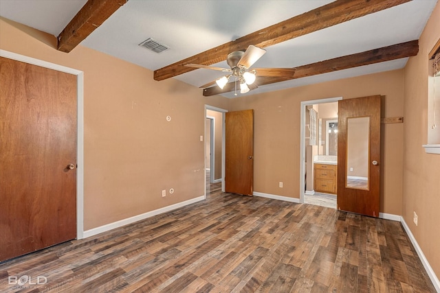 2020 Venus Dr, Bossier City, LA 71112 - unfurnished bedroom featuring beam ceiling, wood finished floors, baseboards, connected bathroom, and ceiling fan