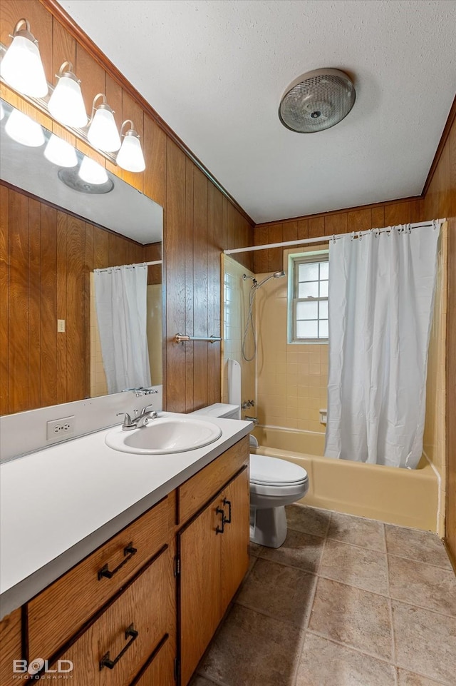 2020 Venus Dr, Bossier City, LA 71112 - full bathroom featuring vanity, shower / bath combo with shower curtain, toilet, wood walls, and a textured ceiling