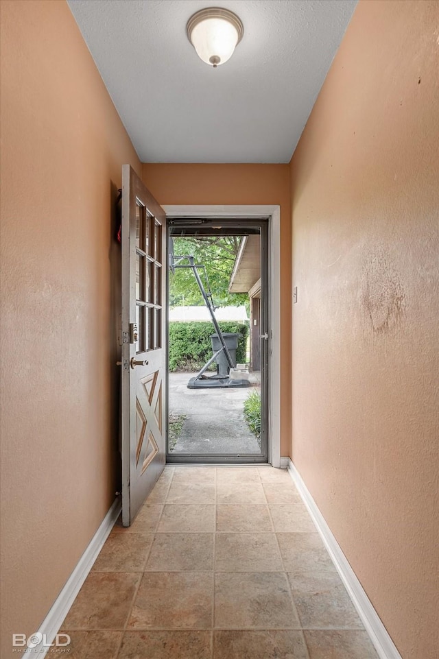 2020 Venus Dr, Bossier City, LA 71112 - entryway featuring baseboards and a textured wall