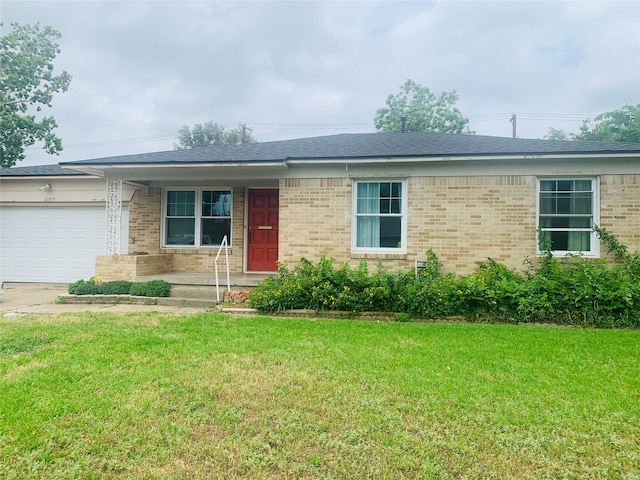 2009 W Way, Garland, TX 75042 - ranch-style house featuring a garage, a front yard, brick siding, and driveway