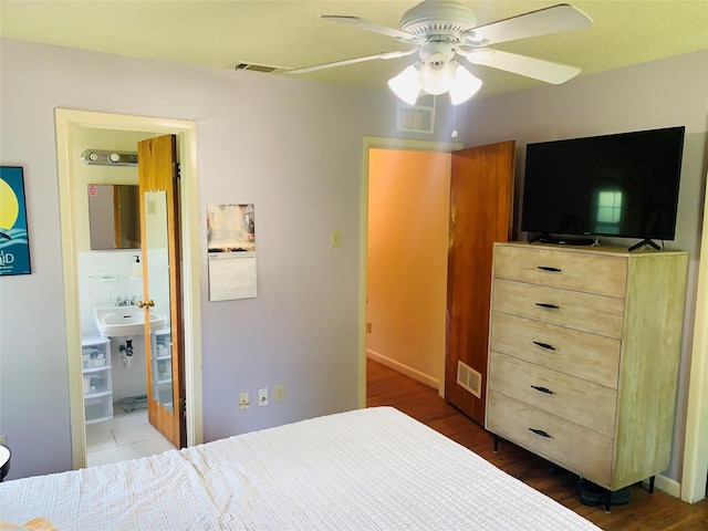2009 W Way, Garland, TX 75042 - bedroom featuring dark wood-type flooring, ceiling fan, and a sink