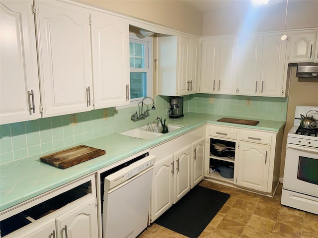 2009 W Way, Garland, TX 75042 - kitchen with white appliances, a sink, white cabinets, tasteful backsplash, and tile counters