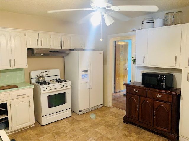 2009 W Way, Garland, TX 75042 - kitchen with white appliances, under cabinet range hood, a ceiling fan, and white cabinets
