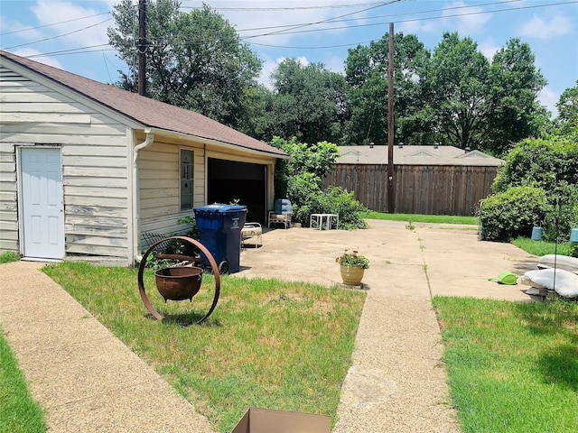 2009 W Way, Garland, TX 75042 - view of yard featuring a patio, an outbuilding, and a detached garage