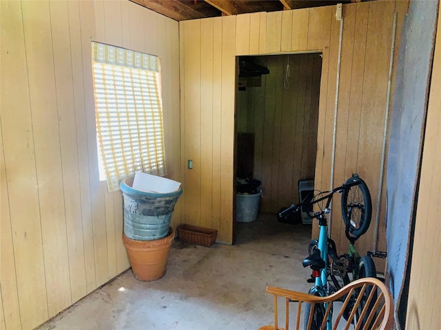 2009 W Way, Garland, TX 75042 - miscellaneous room featuring wood walls, healthy amount of natural light, and concrete floors