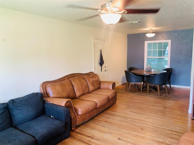 2009 W Way, Garland, TX 75042 - living area with light wood-style flooring, ceiling fan, and baseboards