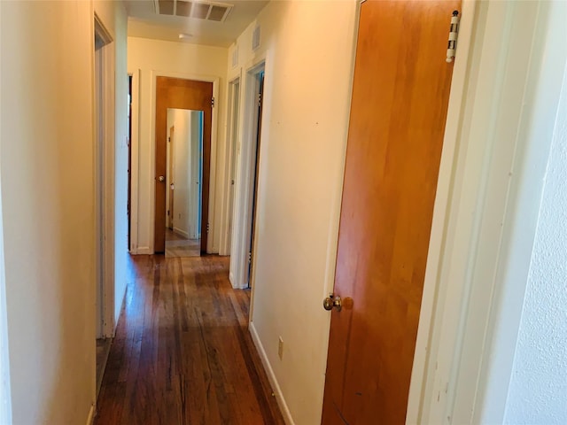 2009 W Way, Garland, TX 75042 - hallway featuring dark wood finished floors and baseboards
