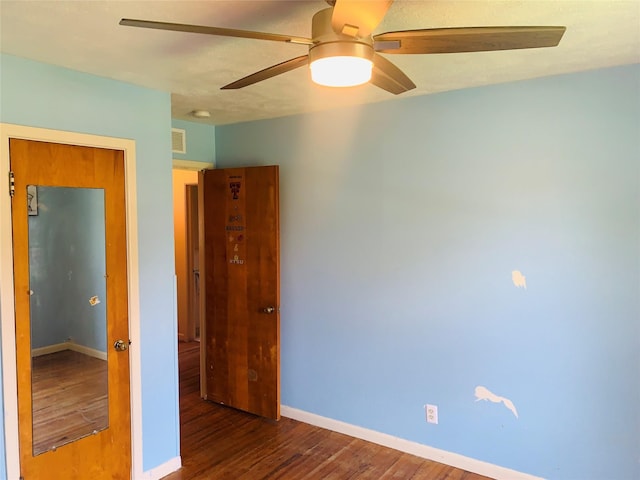 2009 W Way, Garland, TX 75042 - unfurnished bedroom with wood finished floors, baseboards, and ceiling fan