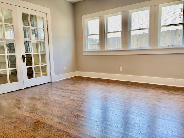 714 Beacon, Dallas, TX 75214 - empty room featuring baseboards, wood finished floors, and french doors