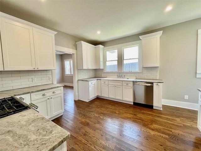 714 Beacon, Dallas, TX 75214 - kitchen with stainless steel dishwasher, backsplash, baseboards, white cabinets, and recessed lighting