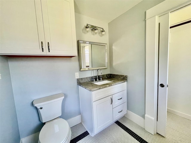 714 Beacon, Dallas, TX 75214 - bathroom featuring toilet, vanity, baseboards, and tile patterned floors
