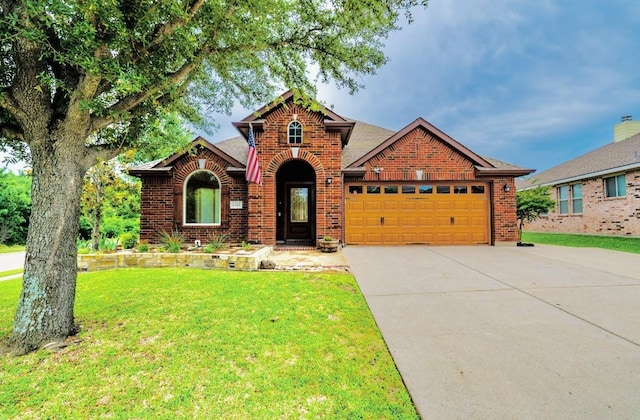 1320 Cedar Branch Dr, Wylie, TX 75098 - traditional home with brick siding, a garage, a front lawn, and concrete driveway