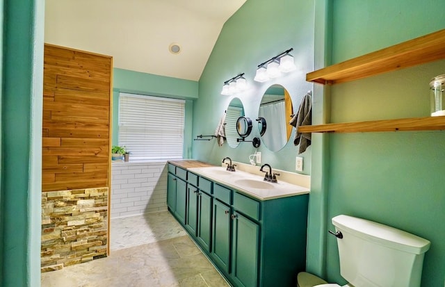 1320 Cedar Branch Dr, Wylie, TX 75098 - bathroom with vaulted ceiling, double vanity, and toilet