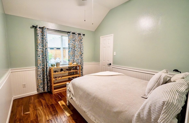 1320 Cedar Branch Dr, Wylie, TX 75098 - bedroom with a wainscoted wall, wood-type flooring, lofted ceiling, and ceiling fan
