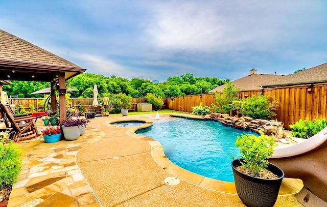 1320 Cedar Branch Dr, Wylie, TX 75098 - view of swimming pool with a fenced backyard, an in-ground hot tub, and a patio