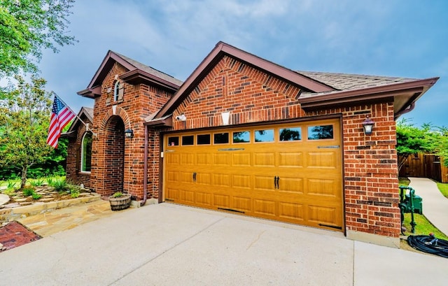 1320 Cedar Branch Dr, Wylie, TX 75098 - view of front of house featuring brick siding, roof with shingles, and a garage