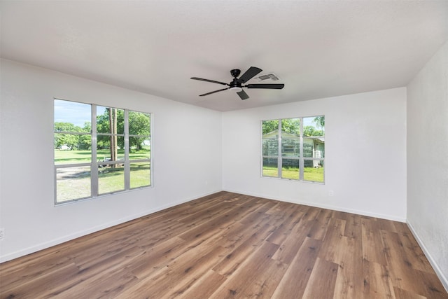 103 Ivy St, Kerens, TX 75144 - empty room with wood finished floors, ceiling fan, and baseboards