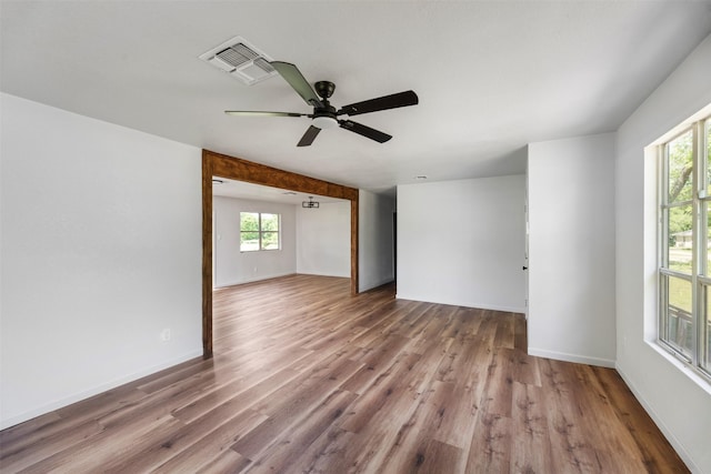 103 Ivy St, Kerens, TX 75144 - spare room with plenty of natural light, wood finished floors, ceiling fan, and baseboards