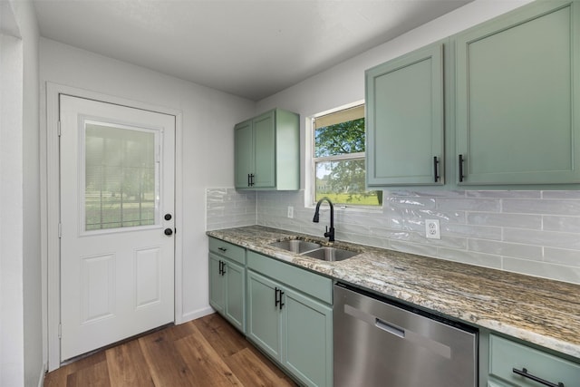 103 Ivy St, Kerens, TX 75144 - kitchen with stainless steel dishwasher, a sink, green cabinets, dark wood finished floors, and decorative backsplash