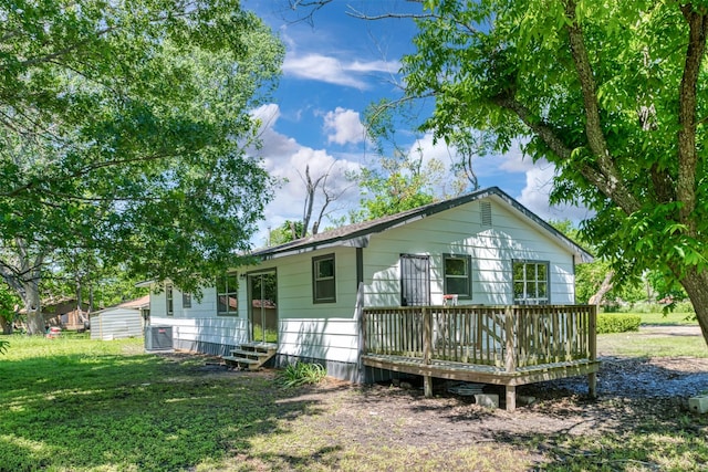 103 Ivy St, Kerens, TX 75144 - view of front of home with central AC, a deck, a front lawn, and entry steps