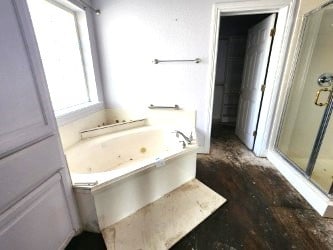 180 Shady Shores Dr, Mabank, TX 75156 - full bath featuring a stall shower, a bath, and wood finished floors
