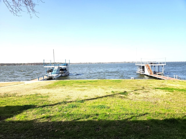 180 Shady Shores Dr, Mabank, TX 75156 - dock area with a water view, boat lift, and a lawn